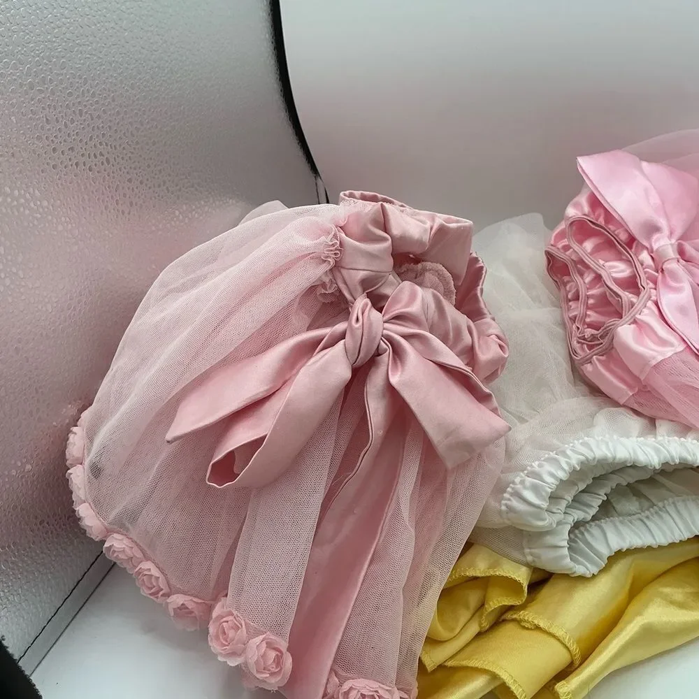 Set of 4 Pink white and Yellow Tutu assorted sizes(2,4,L) but they fit the same